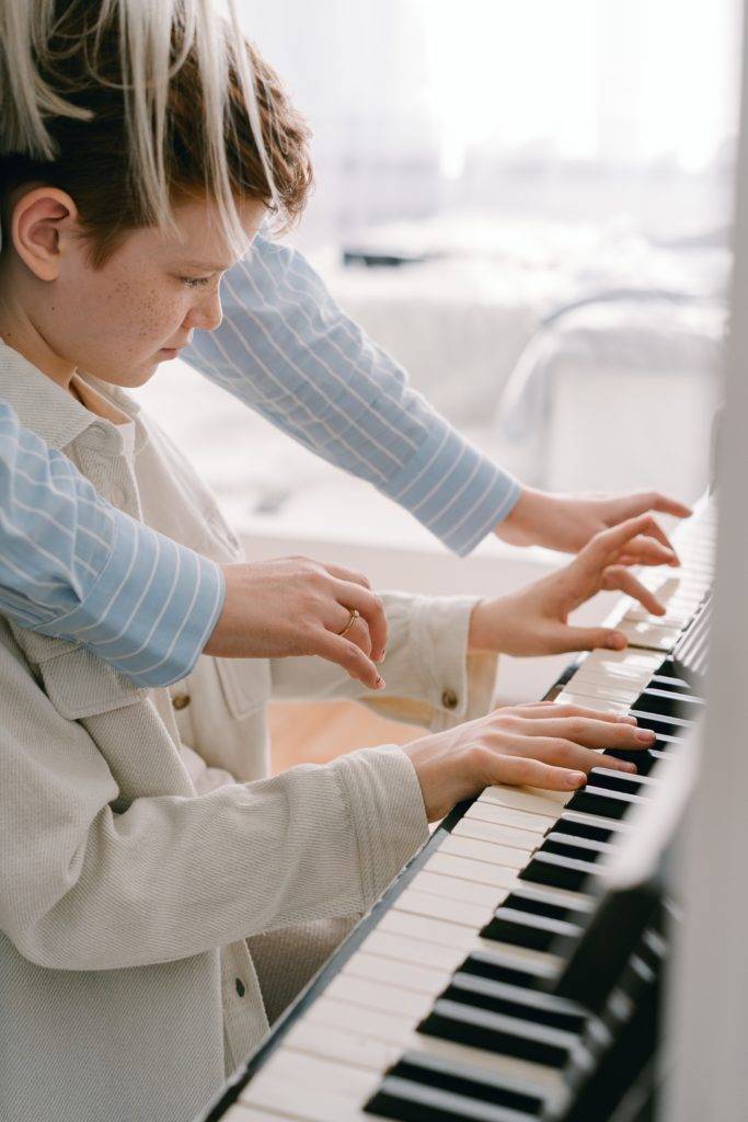 Teacher and piano student